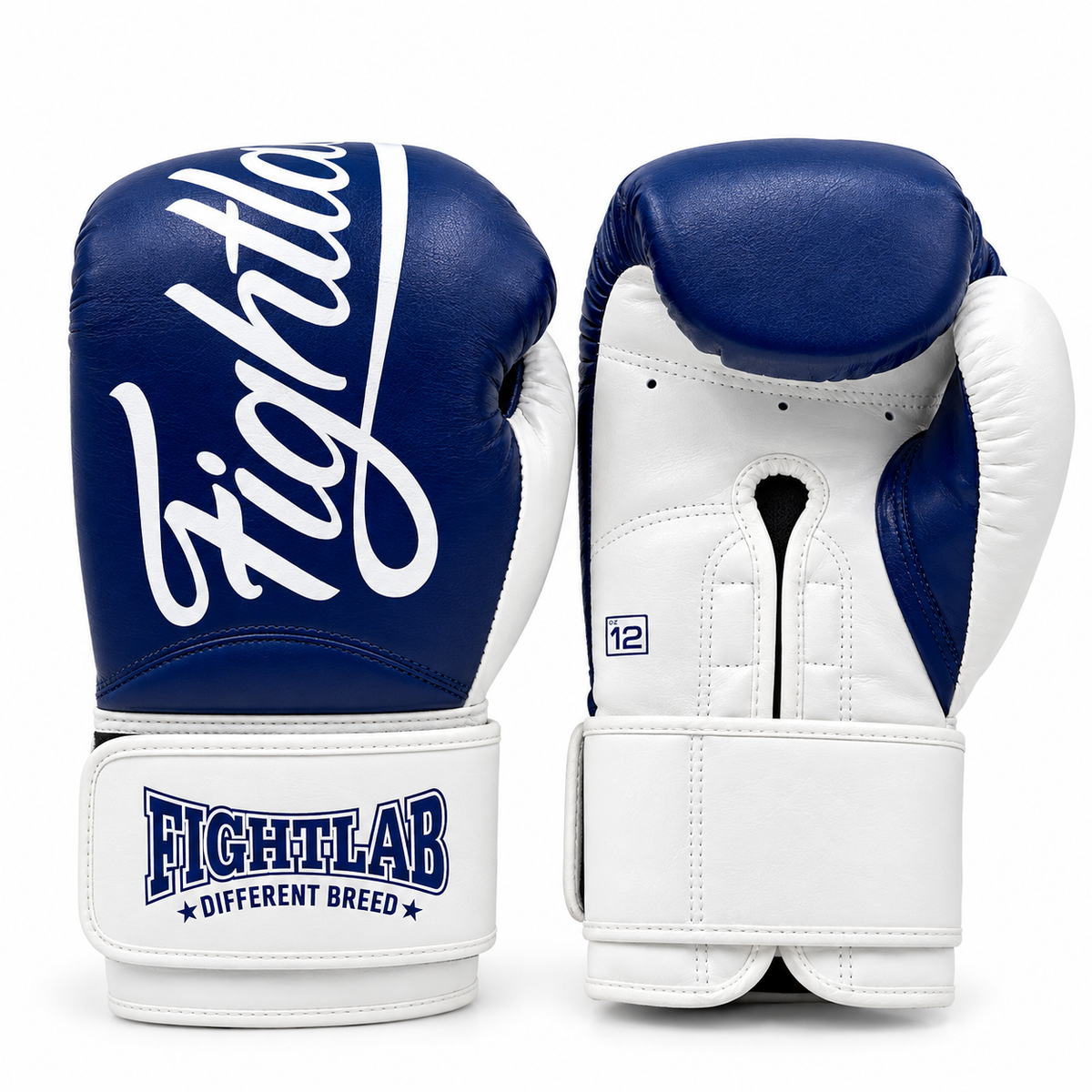 A pair of Fightlab boxing gloves in navy blue and white leather, showing both the front with the white script logo and the back with the brand name 'FIGHTLAB DIFFERENT BREED' on the wrist strap.