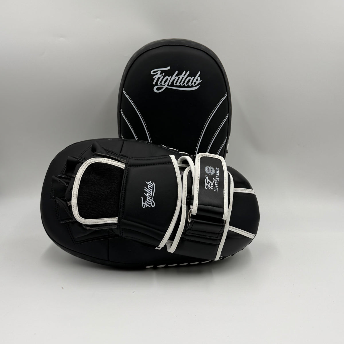 Fightlab Edge Solo Muay Thai pads in black and white