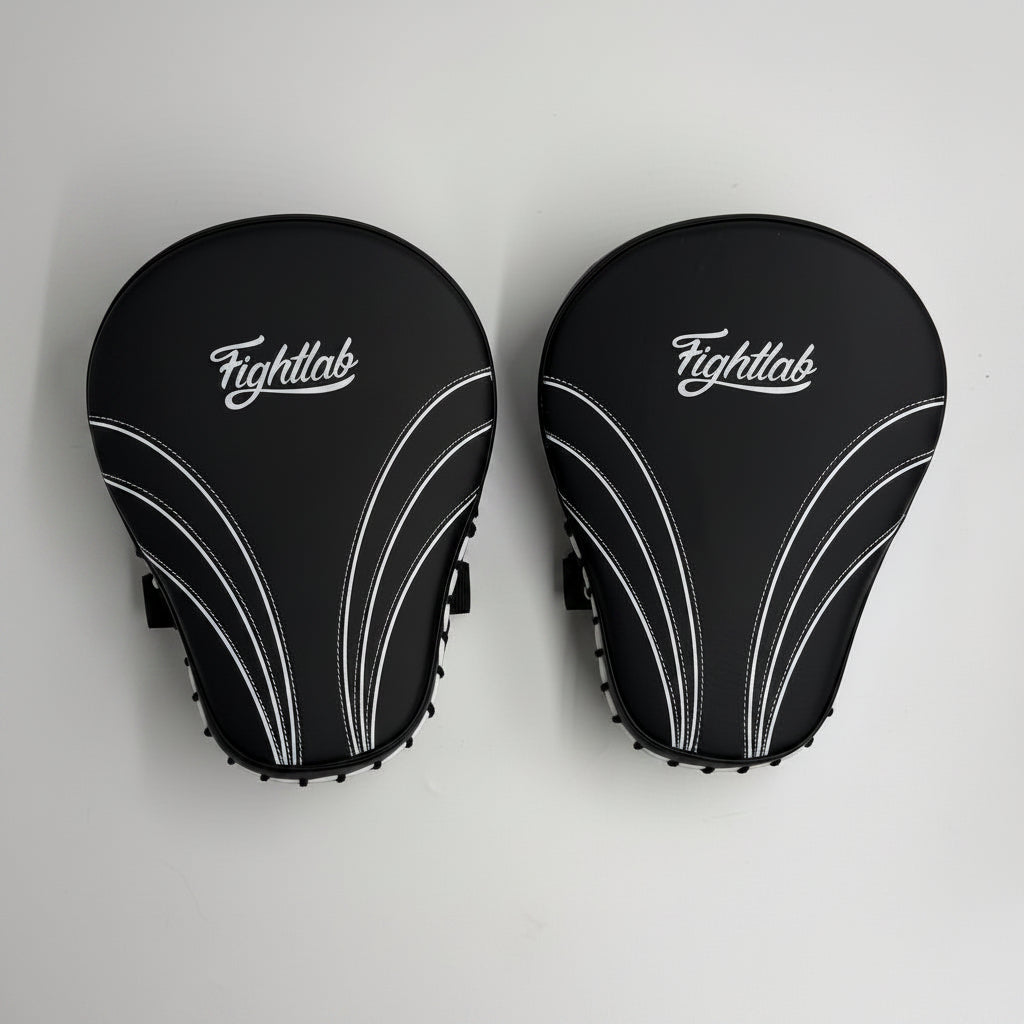 Pair of Fightlab Edge Advanced boxing mitts with white logo and curved accents